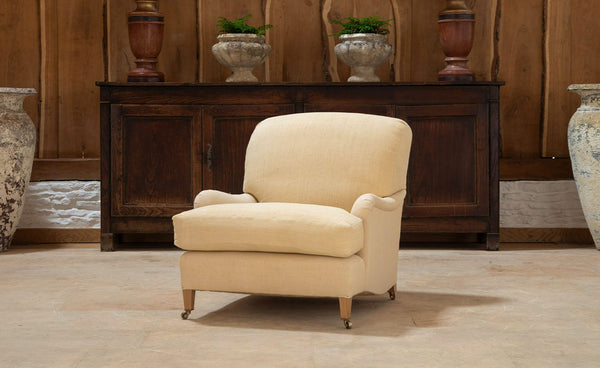 The Kingston Armchair - A traditionally upholstered armchair with fixed back cushion